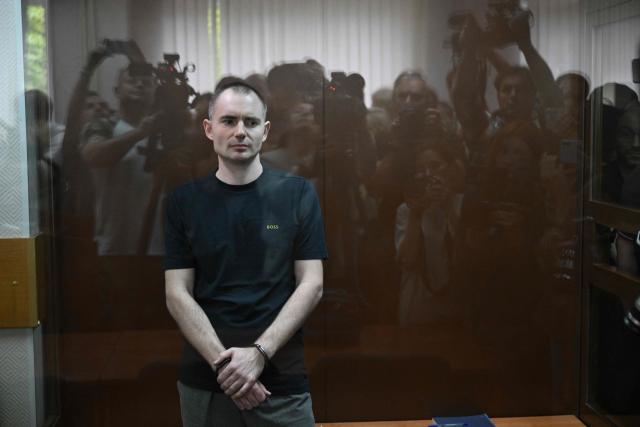 Maxim Kruglov, Russian opposition politician and deputy chair of the liberal Yabloko political party, charged with spreading "fake information" on the Russian army, listens to his verdict at a court in Moscow on June 24, 2026. (Photo by Igor IVANKO / AFP)