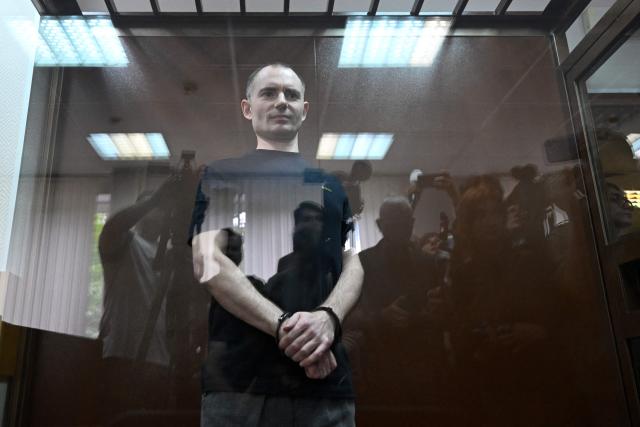 Maxim Kruglov, Russian opposition politician and deputy chair of the liberal Yabloko political party, charged with spreading "fake information" on the Russian army, listens to his verdict at a court in Moscow on June 24, 2026. (Photo by Igor IVANKO / AFP)