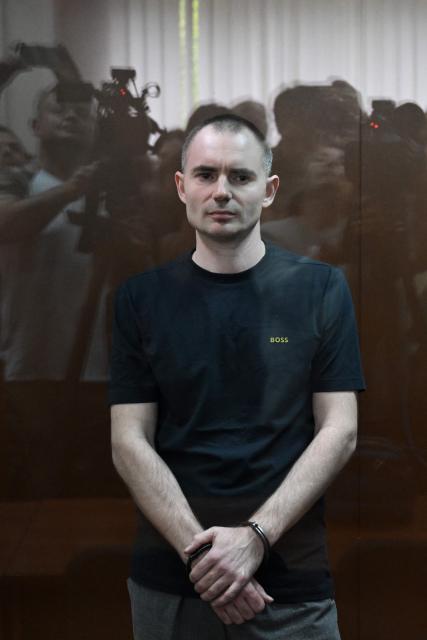 Maxim Kruglov, Russian opposition politician and deputy chair of the liberal Yabloko political party, charged with spreading "fake information" on the Russian army, listens to his verdict at a court in Moscow on June 24, 2026. (Photo by Igor IVANKO / AFP)