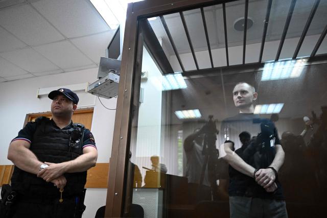Maxim Kruglov, Russian opposition politician and deputy chair of the liberal Yabloko political party, charged with spreading "fake information" on the Russian army, listens to his verdict at a court in Moscow on June 24, 2026. (Photo by Igor IVANKO / AFP)