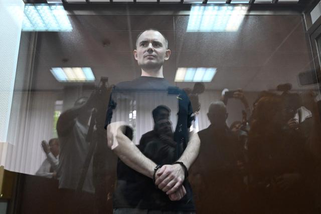 Maxim Kruglov, Russian opposition politician and deputy chair of the liberal Yabloko political party, charged with spreading "fake information" on the Russian army, listens to his verdict at a court in Moscow on June 24, 2026. (Photo by Igor IVANKO / AFP)