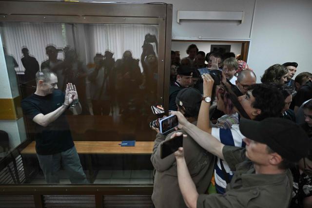 Maxim Kruglov, Russian opposition politician and deputy chair of the liberal Yabloko political party, charged with spreading "fake information" on the Russian army, listens to his verdict at a court in Moscow on June 24, 2026. (Photo by Igor IVANKO / AFP)