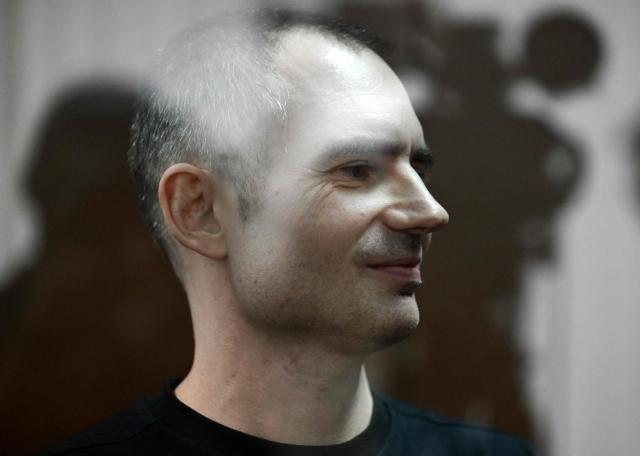 Maxim Kruglov, Russian opposition politician and deputy chair of the liberal Yabloko political party, charged with spreading "fake information" on the Russian army, listens to his verdict at a court in Moscow on June 24, 2026. (Photo by Igor IVANKO / AFP)