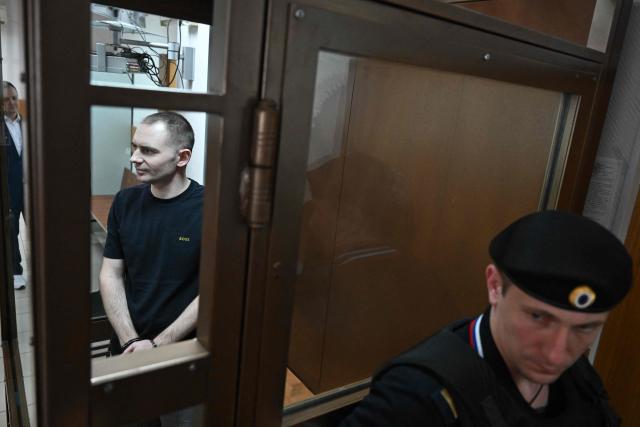 Maxim Kruglov, Russian opposition politician and deputy chair of the liberal Yabloko political party, charged with spreading "fake information" on the Russian army, listens to his verdict at a court in Moscow on June 24, 2026. (Photo by Igor IVANKO / AFP)