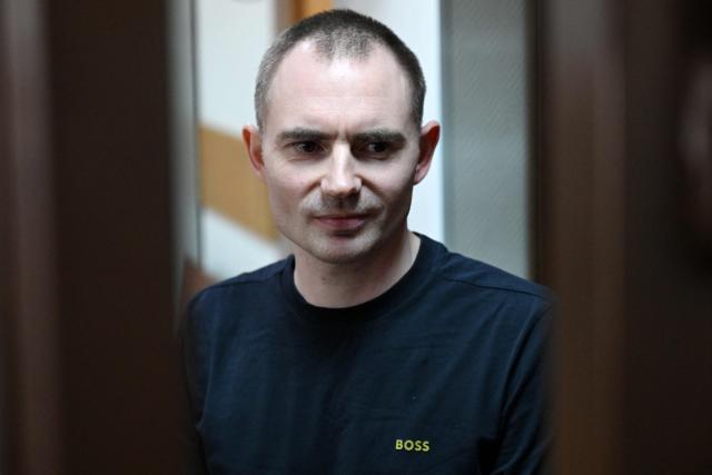 Maxim Kruglov, Russian opposition politician and deputy chair of the liberal Yabloko political party, charged with spreading "fake information" on the Russian army, listens to his verdict at a court in Moscow on June 24, 2026. (Photo by Igor IVANKO / AFP)