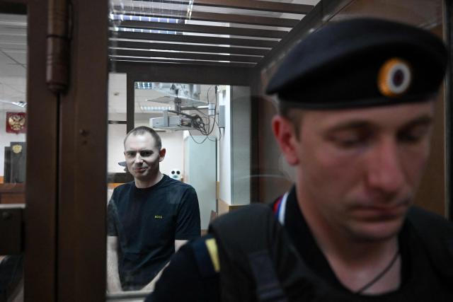 Maxim Kruglov, Russian opposition politician and deputy chair of the liberal Yabloko political party, charged with spreading "fake information" on the Russian army, listens to his verdict at a court in Moscow on June 24, 2026. (Photo by Igor IVANKO / AFP)