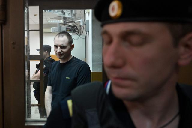 Maxim Kruglov, Russian opposition politician and deputy chair of the liberal Yabloko political party, charged with spreading "fake information" on the Russian army, listens to his verdict at a court in Moscow on June 24, 2026. (Photo by Igor IVANKO / AFP)