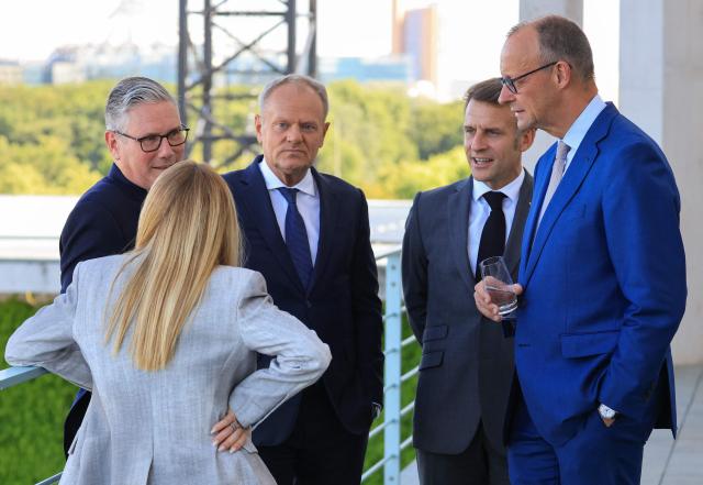 (From L) Italy's Prime Minister Giorgia Meloni, Britain's Prime Minister Keir Starmer, Poland's Prime Minister Donald Tusk, France's President Emmanuel Macron and Germany's Chancellor Friedrich Merz talk on the terrace of the Chancellery at the start of the meeting of State leaders of the European Group of Five (E5) and the NATO Secretary General on June 24, 2026 at the Chancellery in Berlin, Germany. (Photo by Ludovic MARIN / AFP)