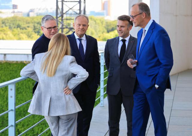 (From L) Italy's Prime Minister Giorgia Meloni, Britain's Prime Minister Keir Starmer, Poland's Prime Minister Donald Tusk, France's President Emmanuel Macron and Germany's Chancellor Friedrich Merz talk on the terrace of the Chancellery at the start of the meeting of State leaders of the European Group of Five (E5) and the NATO Secretary General on June 24, 2026 at the Chancellery in Berlin, Germany. (Photo by Ludovic MARIN / AFP)