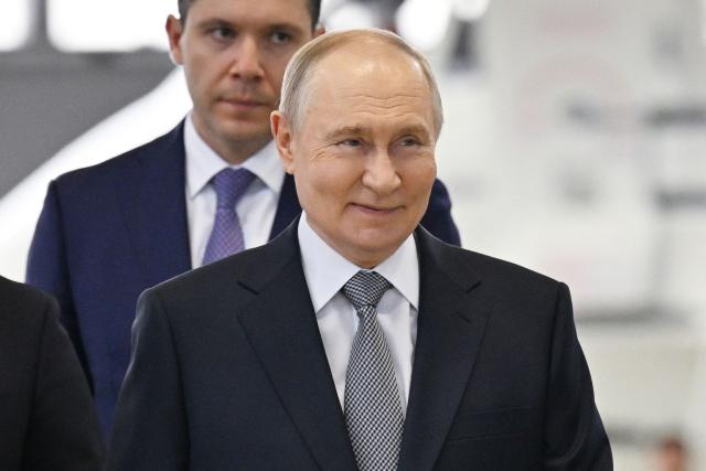 In this pool photograph distributed by the Russian state agency Sputnik, Russia's President Vladimir Putin, accompanied by Minister of Industry and Trade Anton Alikhanov, visits the Flight Research Institute named after M.M. Gromov in Zhukovsky in the Moscow region on June 24, 2026. (Photo by Yuri KOCHETKOV / POOL / AFP)