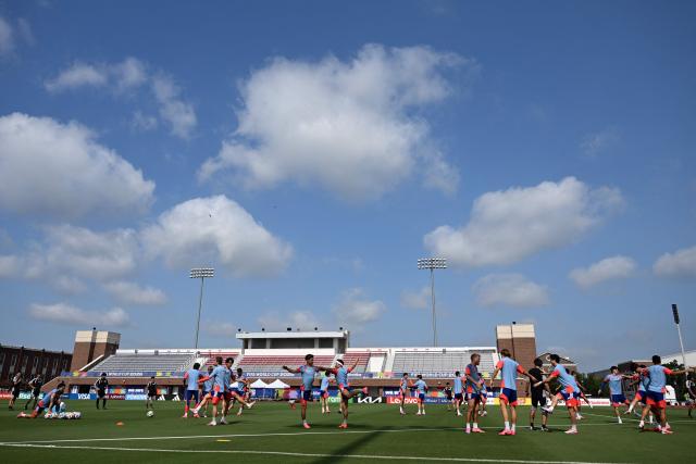 Japan players warm up during a training session on the eve of the 2026 World Cup football tournament Group F football match between Japan and Sweden at Dallas Stadium training facility in Dallas on June 24, 2026. (Photo by Paul ELLIS / AFP)