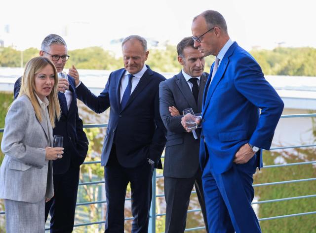 (From L) Italy's Prime Minister Giorgia Meloni, Britain's Prime Minister Keir Starmer, Poland's Prime Minister Donald Tusk, France's President Emmanuel Macron and Germany's Chancellor Friedrich Merz talk on the terrace of the Chancellery at the start of the meeting of State leaders of the European Group of Five (E5) and the NATO Secretary General on June 24, 2026 at the Chancellery in Berlin, Germany. (Photo by Ludovic MARIN / AFP)