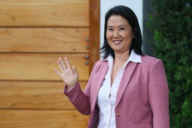 Peru's presidential candidate for the Fuerza Popular party, Keiko Fujimori, waves as she leaves her home in San Borja district, Lima on June 24, 2026. Conservative Keiko Fujimori appeared to win Peru's presidential election, setting the stage for the return of the Fujimori name to power decades after her father's fall. (Photo by Connie FRANCE / AFP)