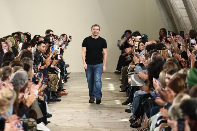 (FILES) French fashion designer Julien Dossena acknowledges the audience following the presentation of his creations by Rabanne for the Women Ready-to-wear Spring-Summer 2026 collection as part of the Paris Fashion Week, at UNESCO headquarters, in Paris on October 2, 2025. Dossena is stepping down from the Spanish luxury fashion house Paco Rabanne, owned by Puig, after more than thirteen years as its artistic director, the brand announced on June 24, 2026. (Photo by Thibaud MORITZ / AFP)