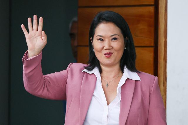Peru's presidential candidate for the Fuerza Popular party, Keiko Fujimori, waves as she leaves her home in San Borja district, Lima on June 24, 2026. Conservative Keiko Fujimori appeared to win Peru's presidential election, setting the stage for the return of the Fujimori name to power decades after her father's fall. (Photo by Connie FRANCE / AFP)