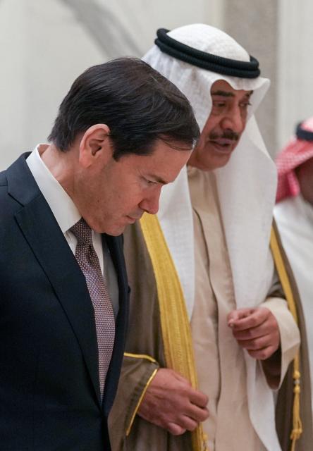 US Secretary of State Marco Rubio walks with Kuwait's Crown Prince Sheikh Sabah Khaled al-Hamad al-Sabah after their meeting at Bayan Palace during Rubio's visit to the Middle East to discuss the interim deal between the US and Iran with Arab Gulf allies, in Kuwait City on June 24, 2026. Rubio held talks with Kuwait's leader on June 24, after renewing Washington's commitment to the region's security in a meeting with the UAE's president during a tour of the Gulf. (Photo by Eric Lee / POOL / AFP)