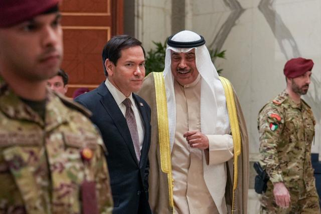 US Secretary of State Marco Rubio walks with Kuwait's Crown Prince Sheikh Sabah Khaled al-Hamad al-Sabah after their meeting at Bayan Palace during Rubio's visit to the Middle East to discuss the interim deal between the US and Iran with Arab Gulf allies, in Kuwait City on June 24, 2026. Rubio held talks with Kuwait's leader on June 24, after renewing Washington's commitment to the region's security in a meeting with the UAE's president during a tour of the Gulf. (Photo by Eric Lee / POOL / AFP)