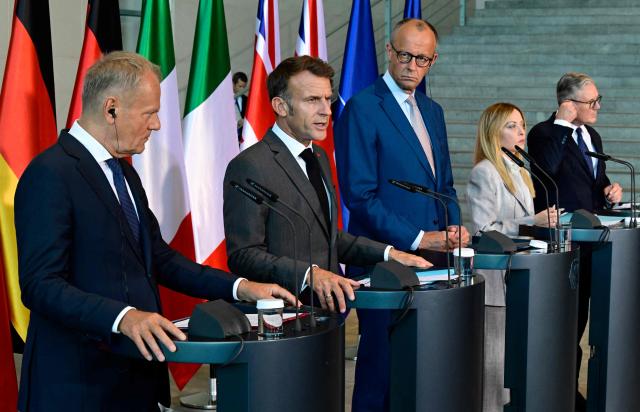 (L-R) Poland's Prime Minister Donald Tusk, France's President Emmanuel Macron, German Chancellor Friedrich Merz, Italy's Prime Minister Giorgia Meloni and Britain's Prime Minister Keir Starmer address the press at the end of their meeting of state leaders of the European Group of Five (E5) and the NATO Secretary General, on June 24, 2026 at the Chancellery in Berlin, Germany. (Photo by John MACDOUGALL / POOL / AFP)