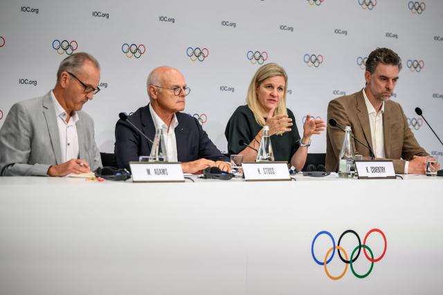 (From L) International Olympic Committee (IOC) spokesperson's Mark Adams, chair of the Olympic programme working group Karl Stoss, IOC President Kirsty Coventry and chair of the athletes' commission Pau Gasol attend a press conference during an IOC session, in Lausanne, on June 24, 2026. (Photo by Fabrice COFFRINI / AFP)