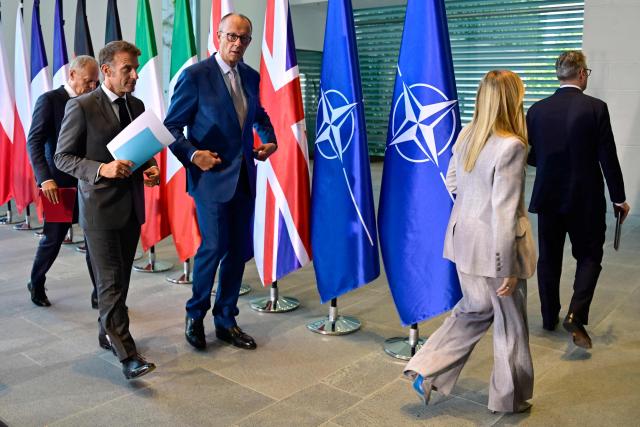 (L-R) Poland's Prime Minister Donald Tusk, France's President Emmanuel Macron, German Chancellor Friedrich Merz, Italy's Prime Minister Giorgia Meloni and Britain's Prime Minister Keir Starmer leave after addressing the press at the end of their meeting of state leaders of the European Group of Five (E5) and the NATO Secretary General, on June 24, 2026 at the Chancellery in Berlin, Germany. (Photo by John MACDOUGALL / POOL / AFP)