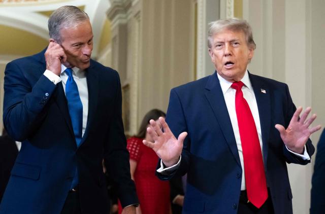 US President Donald Trump, alongside Senate Majority Leader John Thune, Republican from South Dakota, speaks to the press on the way to a lunch meeting with Senate Republicans at the US Capitol in Washington, DC, on June 24, 2026. President Trump said Wednesday he will refuse to sign a landmark housing bill, passed by Congress with broad bipartisan support, until lawmakers approve legislation that would overhaul American elections and restrict voter registration. (Photo by SAUL LOEB / AFP)