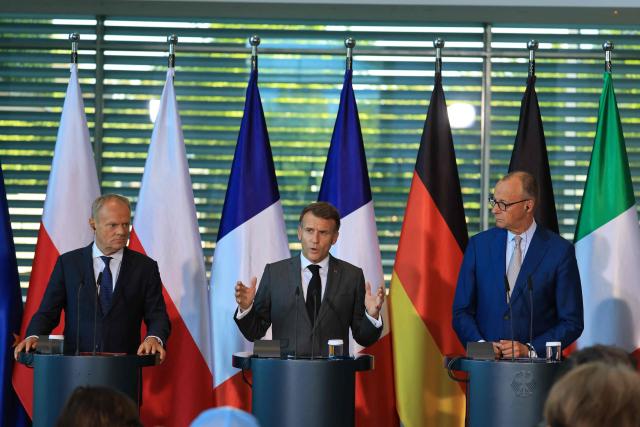 (L-R) Poland's Prime Minister Donald Tusk, France's President Emmanuel Macron and German Chancellor Friedrich Merz address the press at the end of their meeting of state leaders of the European Group of Five (E5) and the NATO Secretary General, on June 24, 2026 at the Chancellery in Berlin, Germany. (Photo by Ludovic MARIN / AFP)