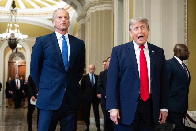 US President Donald Trump, alongside Senate Majority Leader John Thune, Republican from South Dakota, speaks to the press on the way to a lunch meeting with Senate Republicans at the US Capitol in Washington, DC, on June 24, 2026. President Trump said Wednesday he will refuse to sign a landmark housing bill, passed by Congress with broad bipartisan support, until lawmakers approve legislation that would overhaul American elections and restrict voter registration. (Photo by SAUL LOEB / AFP)