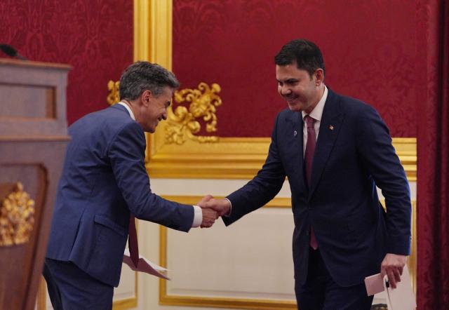Energy Secretary Ed Miliband (L) makes way for Murat Kurum (R), the president of the 2026 United Nations Climate Change Conference (COP31), to make a speech, at a London Climate Week reception, hosted by the Department for Energy Security and Net Zero (DESNZ), at St James's Palace, London on June 24, 2026. (Photo by Yui Mok / POOL / AFP)