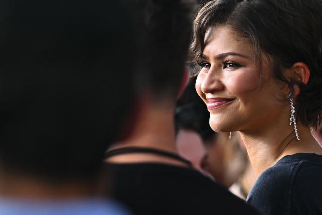 US actress Zendaya reacts as she arrives on the red carpet for a special fan event for the new movie "Spider-man: Brand New Day" at the UGC Cine Cite Bercy, in Paris on June 24, 2026, (Photo by JULIEN DE ROSA / AFP)
