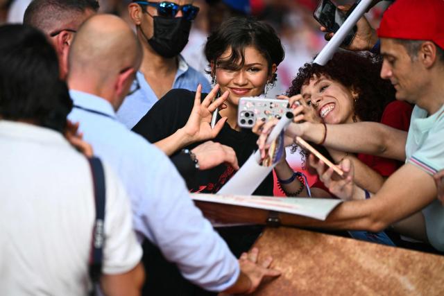 US actress Zendaya poses with fans as she arrives on the red carpet for a special fan event for the new movie "Spider-man: Brand New Day" at the UGC Cine Cite Bercy, in Paris on June 24, 2026, (Photo by JULIEN DE ROSA / AFP)