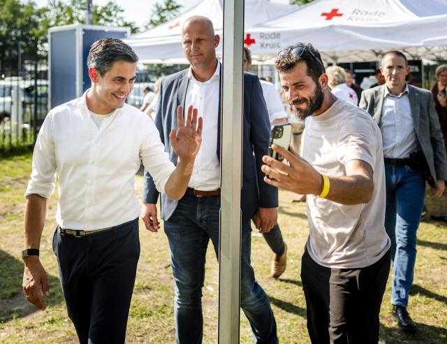 Netherlands' Prime Minister Rob Jetten waves during a visit to the IND registration centre in Ter Apel on June 24, 2026. (Photo by Remko de Waal / ANP / AFP) / Netherlands OUT