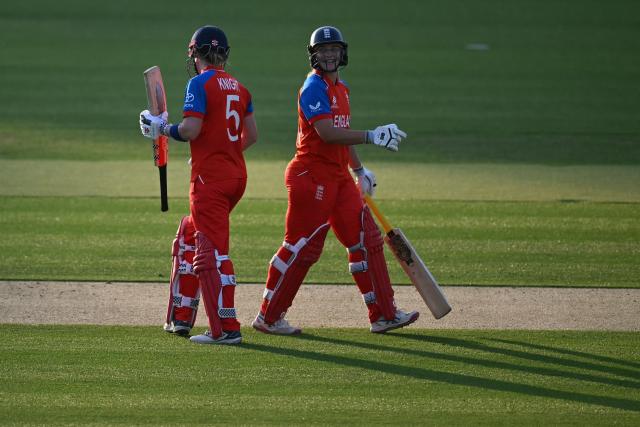 England's Heather Knight (L) and England's Danielle Gibson (R) chat during the ICC Women's T20 cricket world cup 2026 match between England and West Indies, at Lord's in London on June 24, 2026. (Photo by JUSTIN TALLIS / AFP)