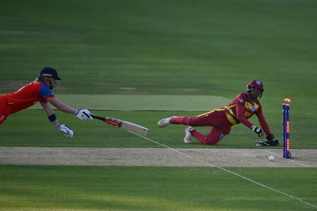 England's Heather Knight is run out by West Indies' Shemaine Campbelle during the ICC Women's T20 cricket world cup 2026 match between England and West Indies, at Lord's in London on June 24, 2026. (Photo by JUSTIN TALLIS / AFP)