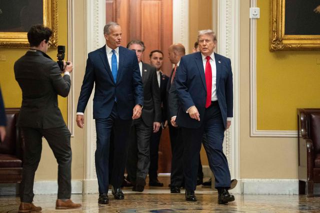 US President Donald Trump walks with Senate Majority Leader John Thune, (R-SD), on the way to a lunch meeting with Senate Republicans at the US Capitol in Washington, DC, on June 24, 2026. President Trump said Wednesday he will refuse to sign a landmark housing bill, passed by Congress with broad bipartisan support, until lawmakers approve legislation that would overhaul American elections and restrict voter registration. (Photo by Aaron Schwartz / AFP)