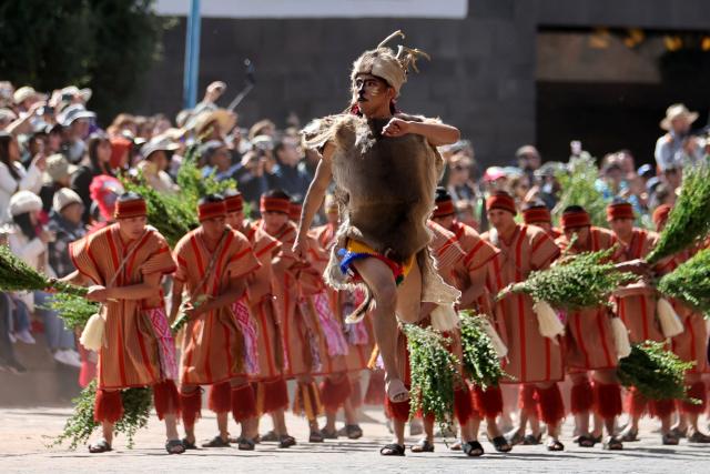 A performer representing the taruka (Andean deer) takes part in a reenactment in front of the Inca temple of Coricancha during the Inti Raymi, a traditional Inca New Year and winter solstice celebration, in Cusco, Peru, on June 24, 2026. The Inti Raymi is the most important indigenous ceremony of the Peruvian Andes, held in honor of the god Inti (Quechua for "sun") at the beginning of the winter solstice. (Photo by Jose Angulo / AFP)