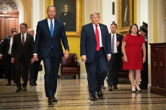 US President Donald Trump walks with Senate Majority Leader John Thune, (R-SD), on the way to a lunch meeting with Senate Republicans at the US Capitol in Washington, DC, on June 24, 2026. President Trump said Wednesday he will refuse to sign a landmark housing bill, passed by Congress with broad bipartisan support, until lawmakers approve legislation that would overhaul American elections and restrict voter registration. (Photo by Aaron Schwartz / AFP)