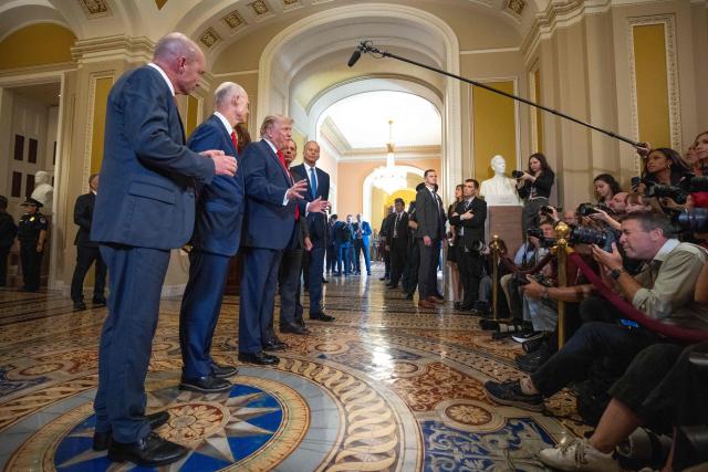 US President Donald Trump (C), alongside (L/R) Senator Mike Lee, Republican from Utah, Senator Rick Scott, Republican from Florida, Senator John Barrasso, Republican from Wyoming, and Senate Majority Leader John Thune, Republican from South Dakota, speaks to the press after a lunch meeting with Senate Republicans at the US Capitol in Washington, DC, on June 24, 2026. President Trump said Wednesday he will refuse to sign a landmark housing bill, passed by Congress with broad bipartisan support, until lawmakers approve legislation that would overhaul American elections and restrict voter registration. (Photo by Aaron Schwartz / AFP)