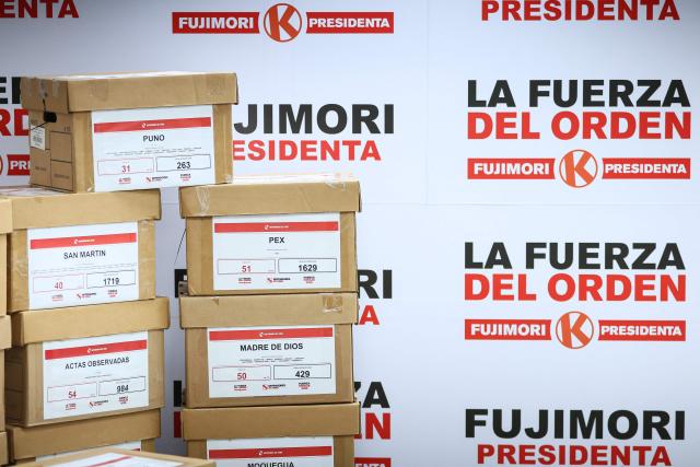 View of boxes with election tally sheets during a press conference of Peru's presidential candidate for the Fuerza Popular party, Keiko Fujimori, at her campaign headquarters in San Borja district, Lima on June 24, 2026. Conservative Keiko Fujimori appeared to win Peru's presidential election, setting the stage for the return of the Fujimori name to power decades after her father's fall. (Photo by Connie FRANCE / AFP)