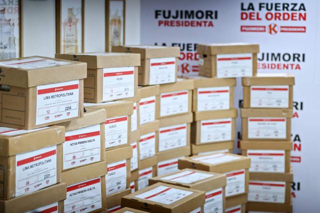 View of boxes with election tally sheets during a press conference of Peru's presidential candidate for the Fuerza Popular party, Keiko Fujimori, at her campaign headquarters in San Borja district, Lima on June 24, 2026. Conservative Keiko Fujimori appeared to win Peru's presidential election, setting the stage for the return of the Fujimori name to power decades after her father's fall. (Photo by Connie FRANCE / AFP)