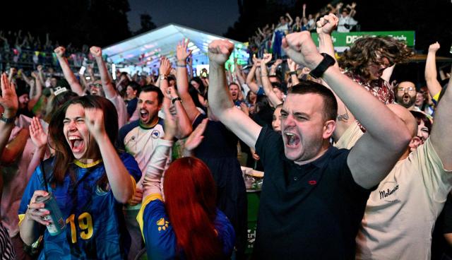 Bosnia and Herzegovina's supporters cheer during a public viewing of the Bosnia and Herzegovina World Cup 2026 football match against Qatar in Sarajevo on June 24, 2026. (Photo by ELVIS BARUKCIC / AFP)