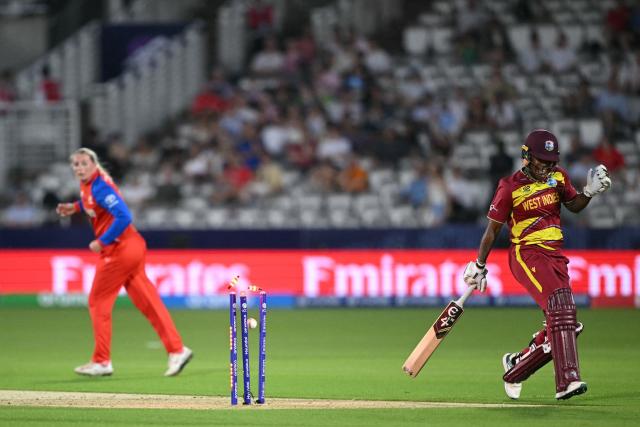 England's Sophie Ecclestone splits the stumps but West Indies' Chinelle Henry was easily home during the ICC Women's T20 cricket world cup 2026 match between England and West Indies, at Lord's in London on June 24, 2026. (Photo by JUSTIN TALLIS / AFP)
