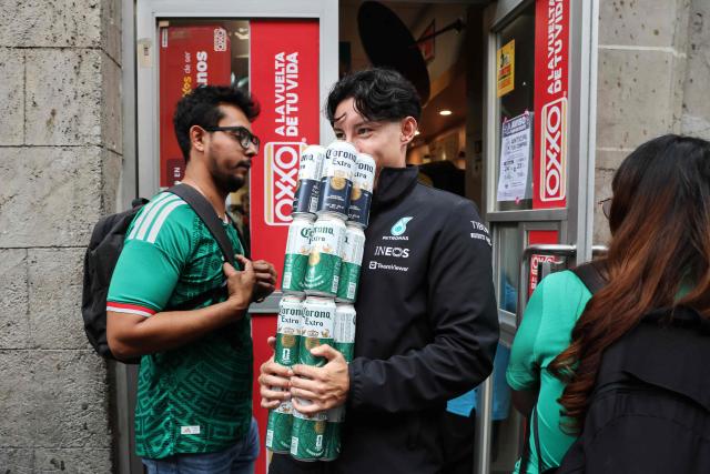 People buy alcohol before a temporary alcohol ban ahead of the FIFA World Cup 2026 match between Mexico and Czechia, in Mexico City on June 24, 2026. (Photo by Claudia Rosel / AFP)