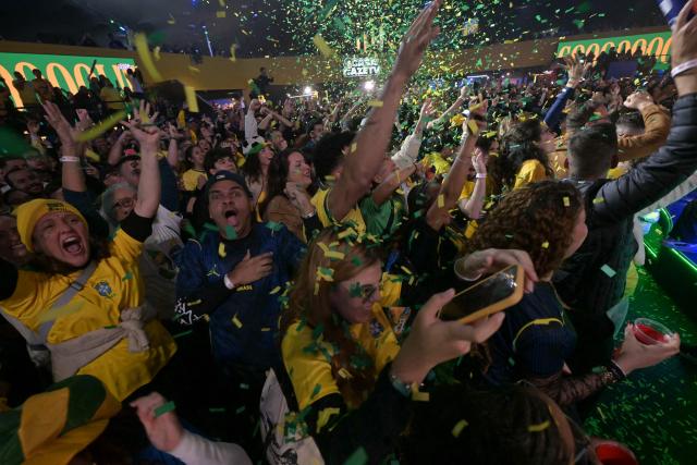 Brazilian fans react as they watch a live broadcast of the 2026 FIFA World Cup football match between Brazil and Scotland at Casa Caze TV in Sao Paulo, Brazil, on June 24, 2026. (Photo by NELSON ALMEIDA / AFP)