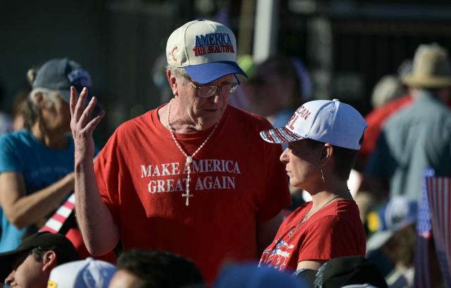 An attendee wears an "Make America Great Again" t-shirt during a kick-off celebration for the "Great American State Fair" on the National Mall in Washington, DC, June 24, 2026. The "Great American State Fair" will be held from June 25 to July 10, 2026, to celebrate the 250th anniversary of US independence. (Photo by Oliver Contreras / AFP)