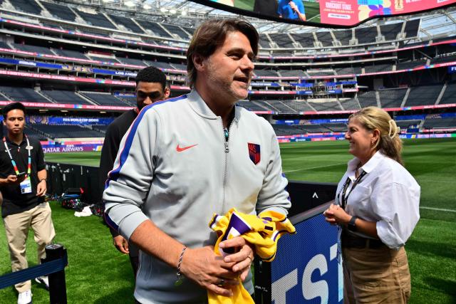 US Argentine head coach Mauricio Pochettino holds a Los Angeles Lakers jersey gifted by Los Angeles Lakers head coach JJ Redick (unseen) at Los Angeles Stadium on June 24, 2026, on the eve of the 2026 World Cup football tournament Group D football match against Turkey and the USA. (Photo by Frederic J. Brown / AFP)