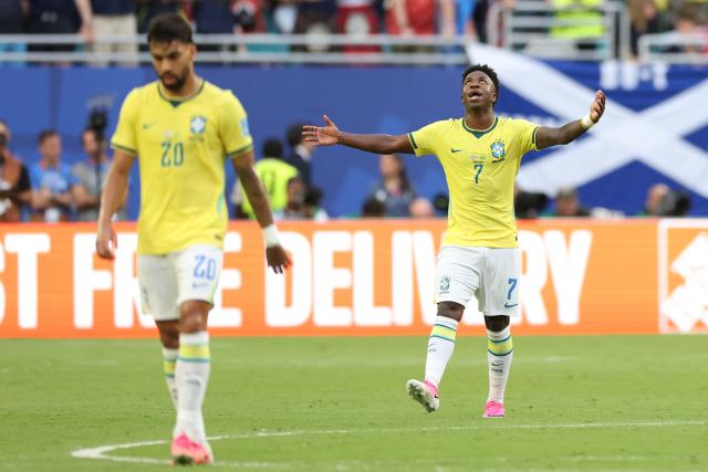 Brazil's forward #07 Vinicius Junior reacts after scoring a goal later dissalowed by a VAR desicion during the 2026 World Cup Group C football match between Scotland and Brazil at the Miami Stadium in Miami Gardens on June 24, 2026.  (Photo by PATRICIA DE MELO MOREIRA / AFP)