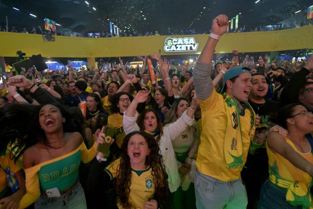 Brazilian fans react as they watch a live broadcast of the 2026 FIFA World Cup football match between Brazil and Scotland at Casa Caze TV in Sao Paulo, Brazil, on June 24, 2026. (Photo by NELSON ALMEIDA / AFP)