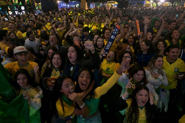 Brazilian fans react as they watch a live broadcast of the 2026 FIFA World Cup football match between Brazil and Scotland at Casa Caze TV in Sao Paulo, Brazil, on June 24, 2026. (Photo by NELSON ALMEIDA / AFP)