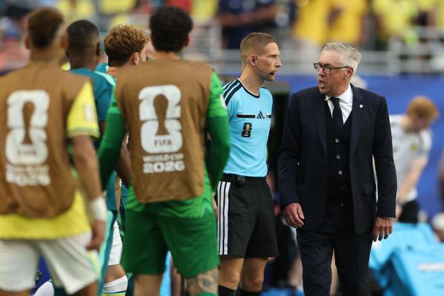Brazil's Italian head coach Carlo Ancelotti talks to Norwegian referee Jan Erik Engan during the 2026 World Cup Group C football match between Scotland and Brazil at the Miami Stadium in Miami Gardens on June 24, 2026.  (Photo by PATRICIA DE MELO MOREIRA / AFP)