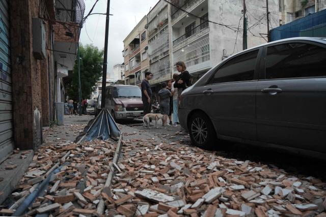 Debris lies on a street following an earthquake in Caracas on June 24, 2026. A magnitude 7.1 earthquake struck Venezuela on Wednesday, the United States Geological Survey (USGS) reported, triggering panic in Caracas, according to AFP journalists. The tremor, which was followed by several aftershocks, was also felt in Colombia. (Photo by Manaure QUINTERO / AFP)